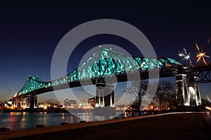 Montreal 375th anniversary. Jacques Cartier Bridge. Bridge panoramic colorful silhouette by night